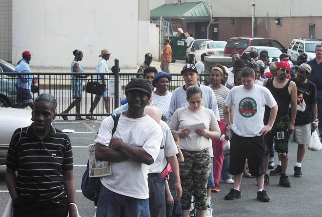 People lining up outside the Cathedral Kitchen for a meal