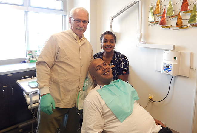 Dr. Martin with his assistant and a patient